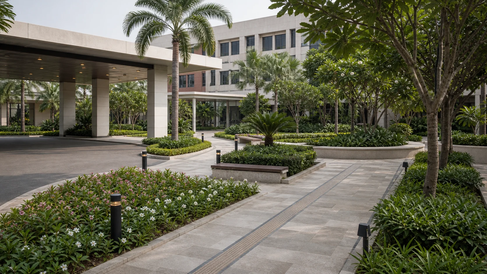 Hospital landscape with calm garden walkway, structured planting, and accessible outdoor circulation.